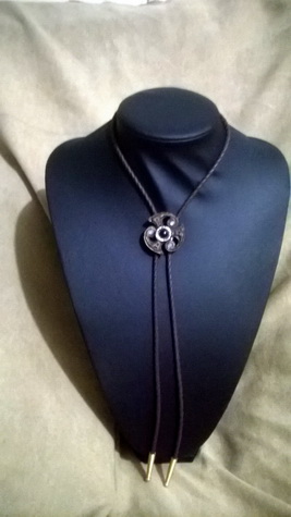 Triskel Bolo with black onyx and Moonstone
